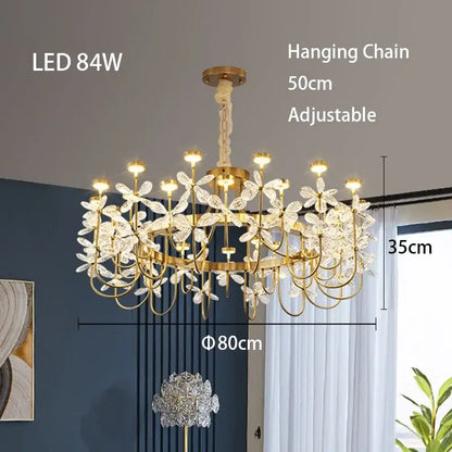 Gold-toned decorbites butterfly chandelier with delicate crystal flower accents and adjustable hanging chain for dining room light