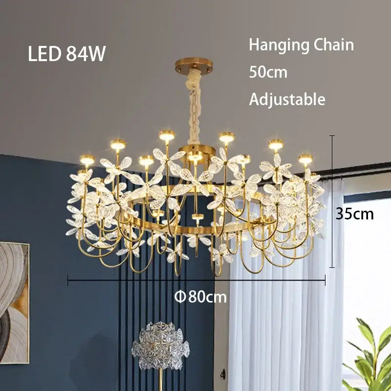 Gold-toned decorbites butterfly chandelier with delicate crystal flower accents and adjustable hanging chain for dining room light