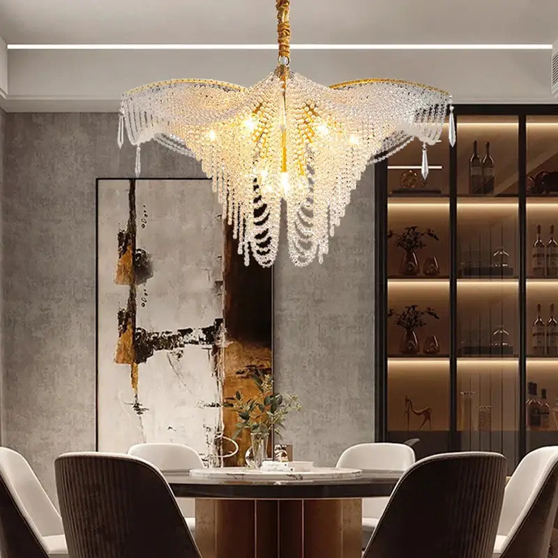 A luxurious gold-toned decorbites butterfly crystal bead large chandelier with cascading crystal droplets for living room