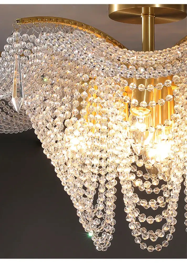 A decorbites butterfly crystal bead large gold chandelier with cascading clear faceted beads for living room decor
