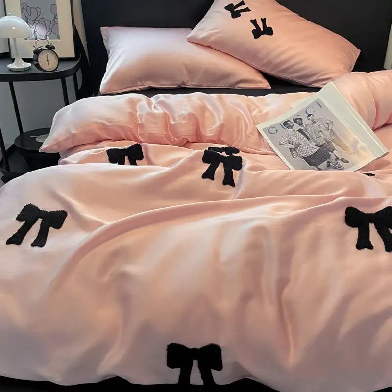 Pink satin duvet cover with black embroidered bows featuring decorbites butterfly embroidered design for bedroom decor
