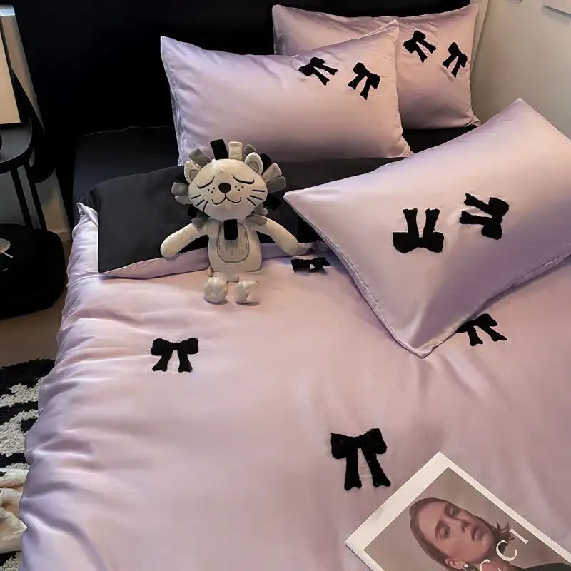 Pastel lavender satin bedding set with black embroidered bows featuring decorbites butterfly embroidered design