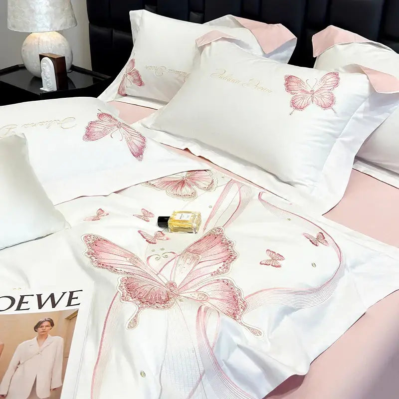 White satin bedding set with decorbites butterfly embroidery pink accents and gold script for luxury bedrooms