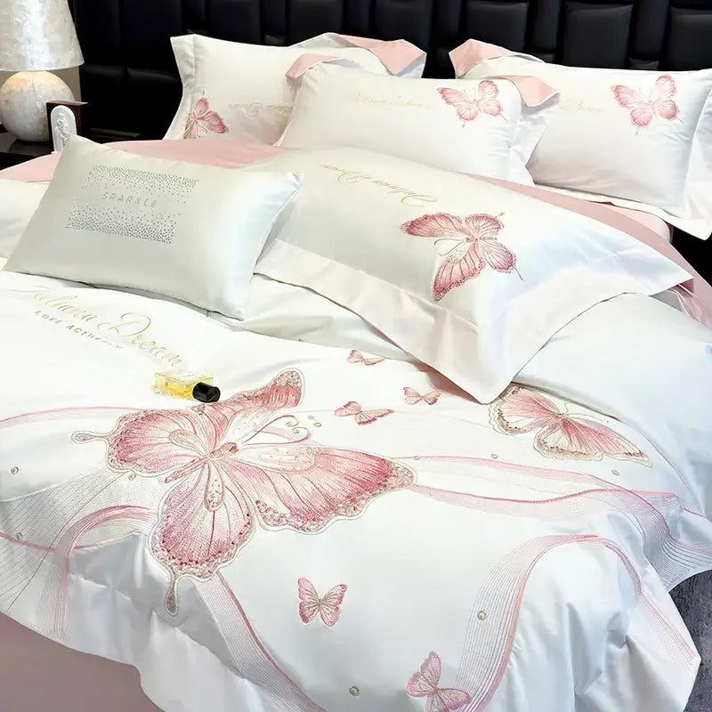 White satin bedding set with decorbites butterfly embroidery in pink and gold accents for luxury bedroom decor
