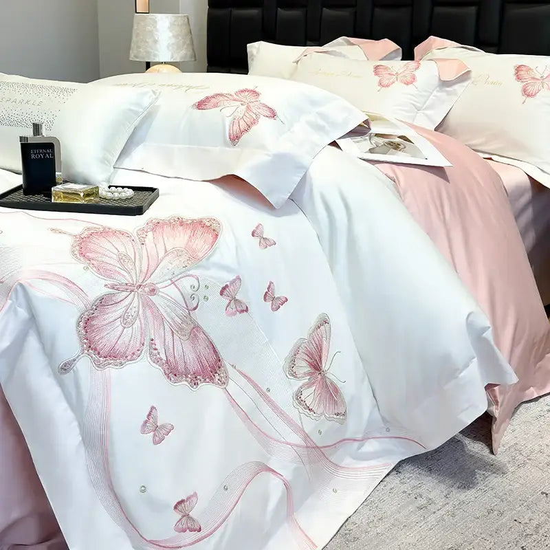 White satin duvet cover with delicate pink decorbites butterfly embroidery and subtle beaded accents bedding set