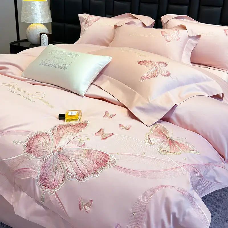 Pink satin bedding set with decorbites butterfly embroidery featuring intricate shimmering details for luxury bedroom