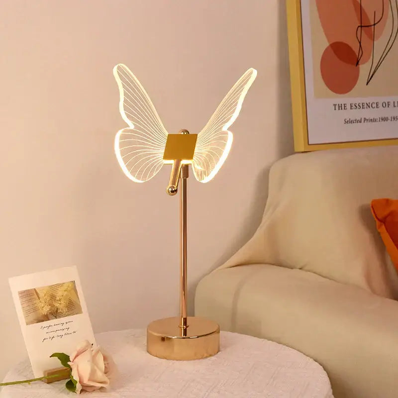 Decorbites butterfly gold acrylic led desk lamp with illuminated wings and sleek metallic base for living room use