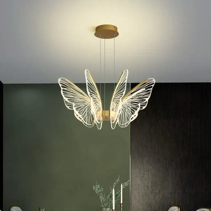 Gold-toned decorbites butterfly led chandelier pendant light with intricate white wireframe wings for bedroom use