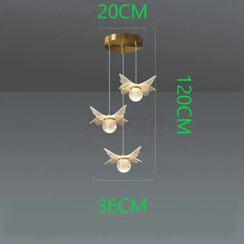 Gold-toned decorbites butterfly led pendant light with three glass globe bulbs for bedroom use
