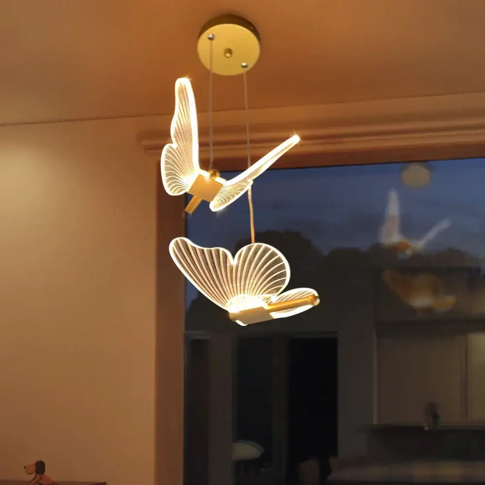 Golden decorbites butterfly led pendant light with illuminated wings and sleek modern design for living room and bedroom