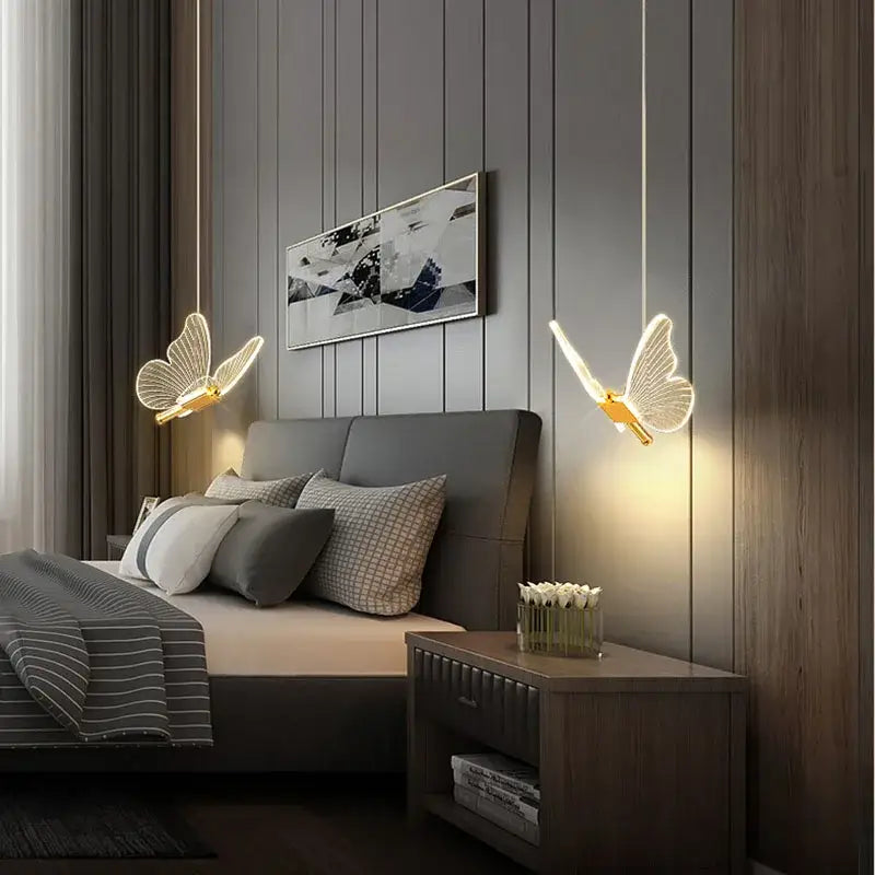 Golden decorbites butterfly pendant light with translucent wings hanging above bed for elegant dining room decor