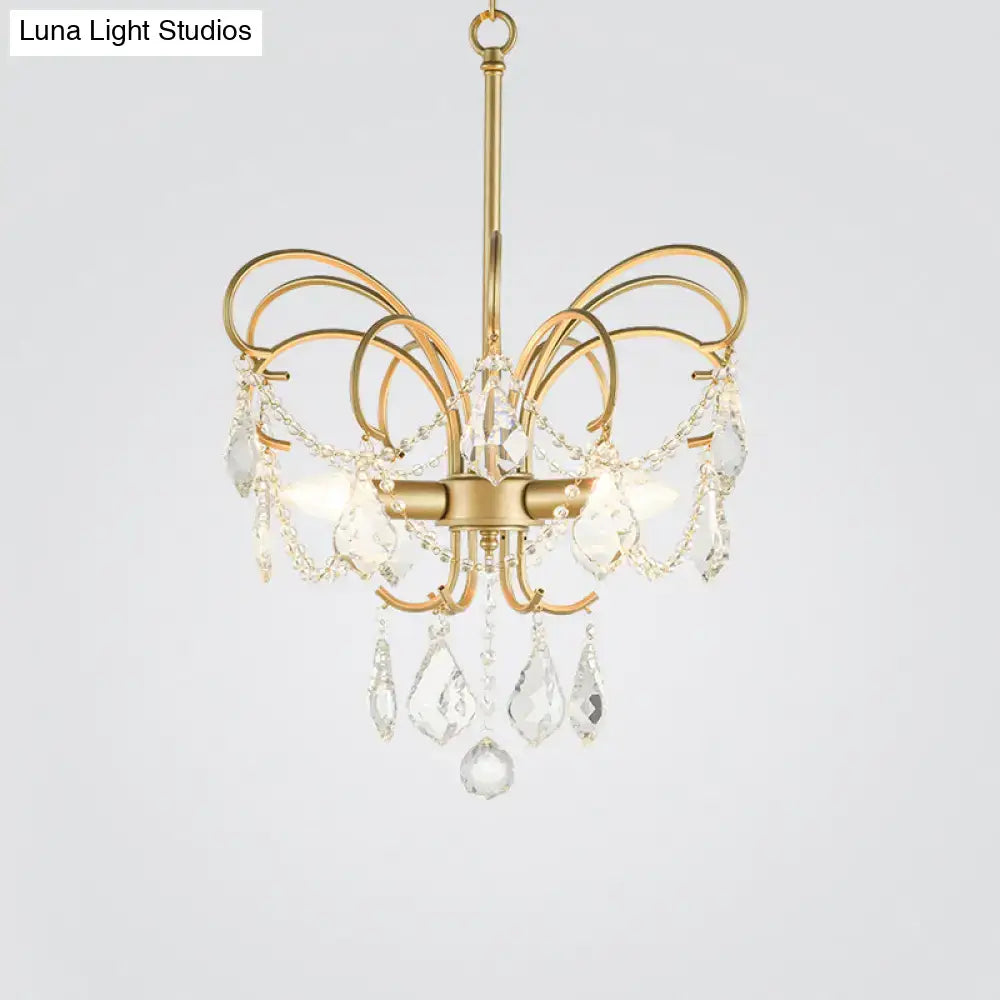 Gold-toned DecorBites™ butterfly shaped chandelier with curved arms and crystal droplets 18 inch fixture for living room