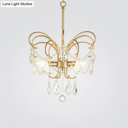 Gold-toned DecorBites™ butterfly shaped chandelier with curved arms and crystal droplets 18 inch fixture for living room