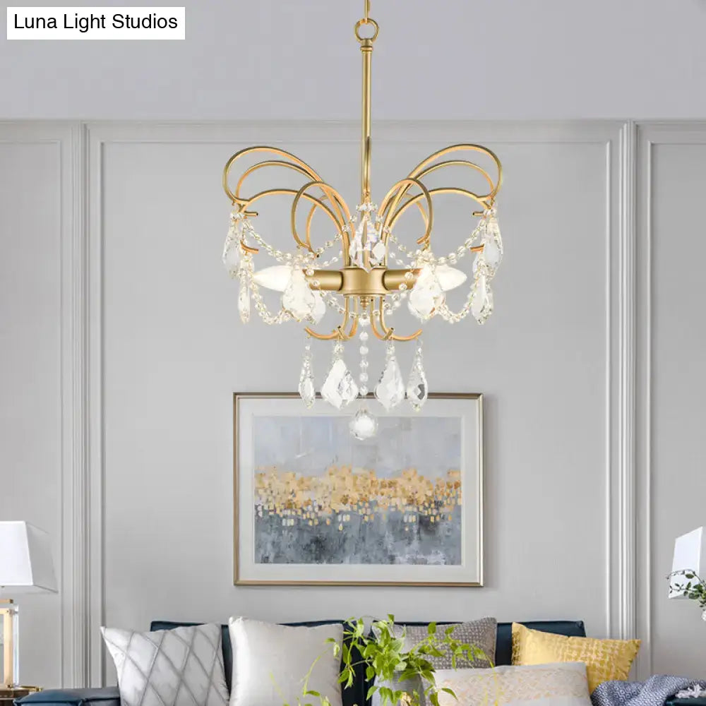Gold-toned decorbites butterfly shaped chandelier with curved arms and crystal accents 15 inch fixture for living room