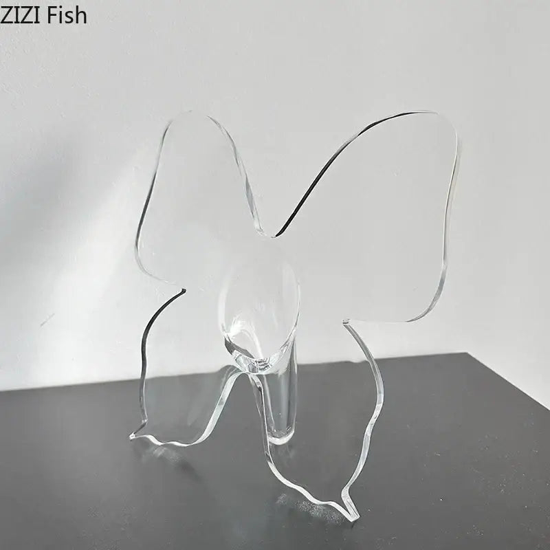 Clear acrylic butterfly vase with transparent wings and sleek base for aesthetic room decor by DecorBites™