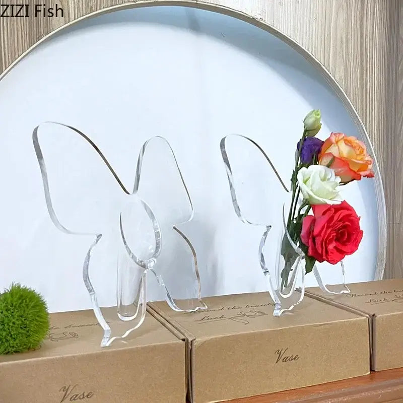 Clear acrylic butterfly vase holding a bouquet of colorful flowers for aesthetic room decor by DecorBites™