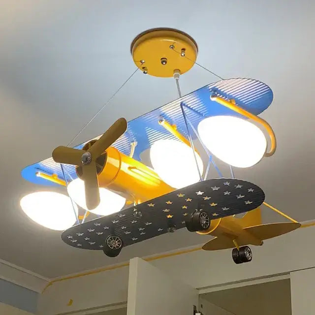 Yellow and blue decorbites cartoon aircraft fan light with star-patterned wings for bedroom ceiling lighting