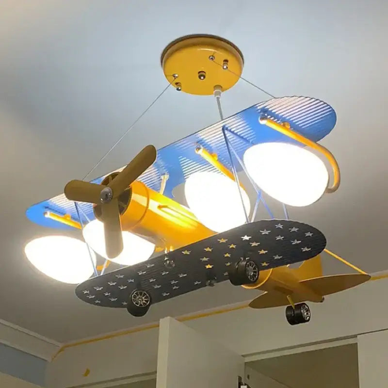 Decorbites cartoon aircraft fan light in vibrant yellow and blue with star-patterned wings for bedroom ceiling use