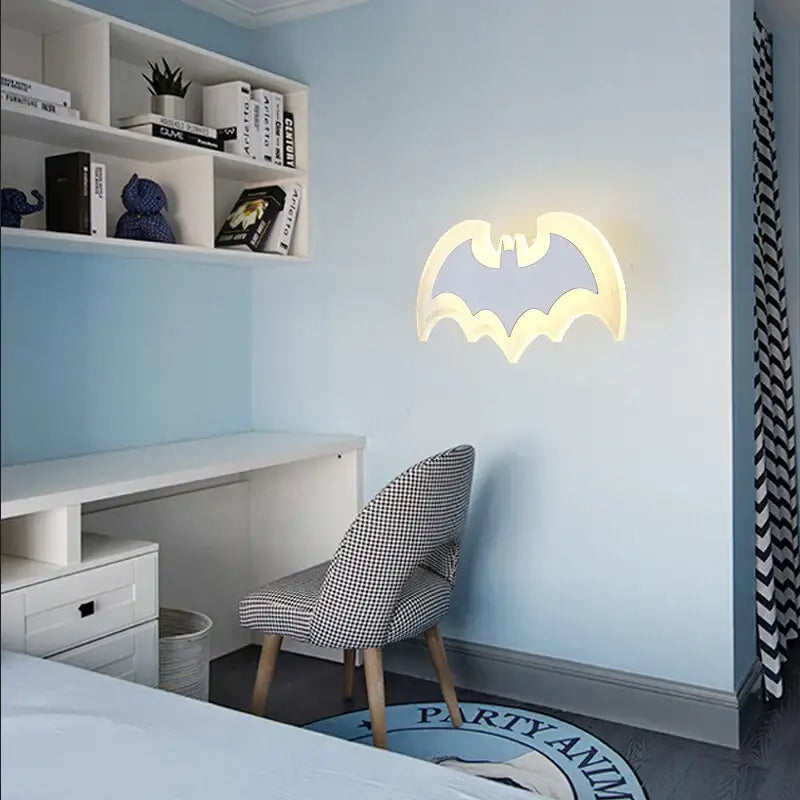 A glowing yellow decorbites cartoon bat wall lamp with sleek acrylic design for bedroom decor