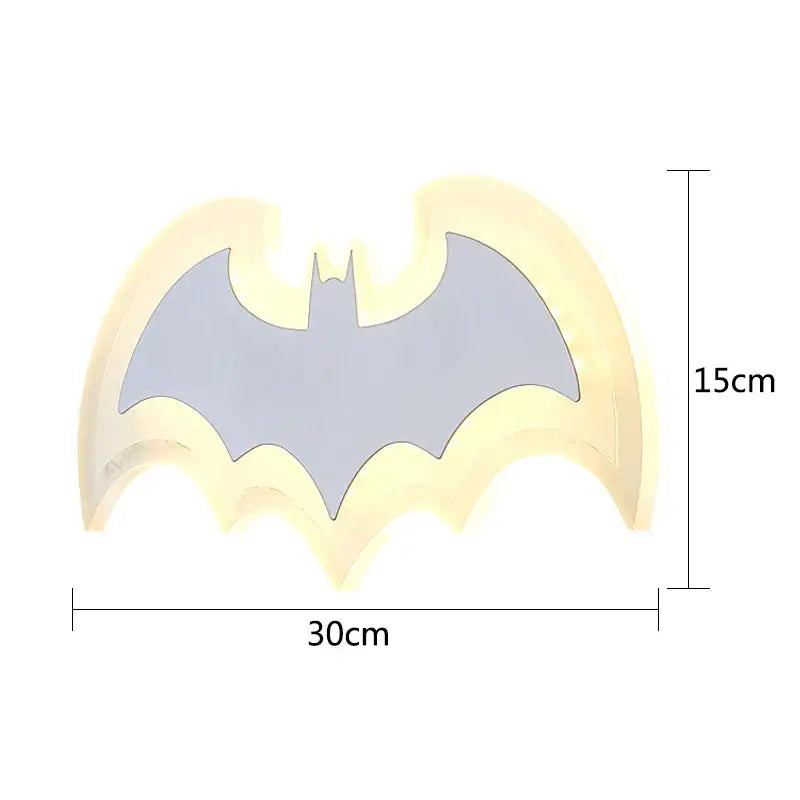 A glowing yellow and gray decorbites cartoon bat wall lamp made of warm yellow acrylic for bedroom lighting