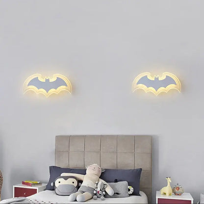 Decorbites cartoon bat wall lamp features two illuminated acrylic sconces with warm yellow glow and gray inner design