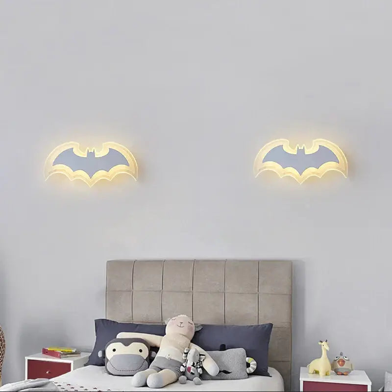 Decorbites cartoon bat wall lamp features two illuminated acrylic sconces with warm yellow glow and gray inner design