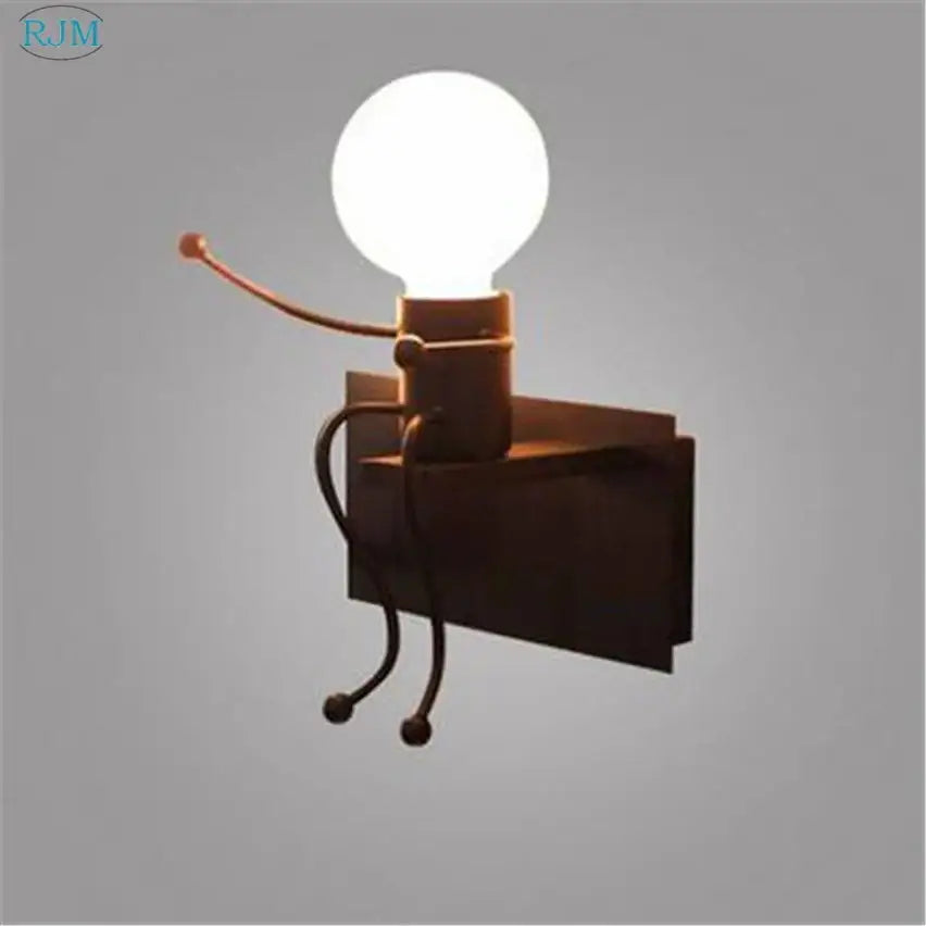 Rustic metal robot-shaped decorbites cartoon children iron wall lamp with glowing white bulb head and articulated limbs