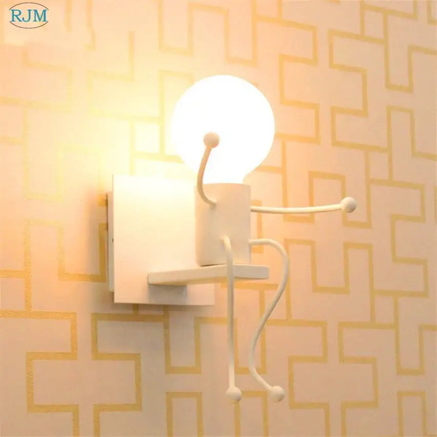 White ceramic decorbites cartoon children iron wall lamp with articulated limbs and glowing spherical head for bedroom decor