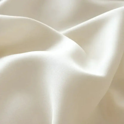 Cream-colored satin fabric with smooth glossy folds in decorbites cartoon embroidered pink and cream bedding set cotton