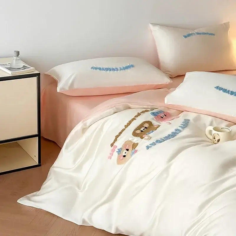 Cream-colored satin duvet cover with embroidered cartoon bears and blue lettering from decorbites cartoon embroidered cotton bedding set