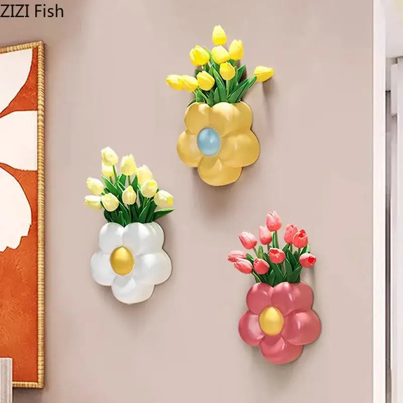Three wall-mounted decorbites cartoon flower vases in yellow white and pink holding tulips for bedroom decor