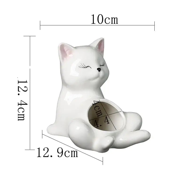 White ceramic decorbites cartoon kitten flowerpot with closed eyes and pink inner ears for succulent plants