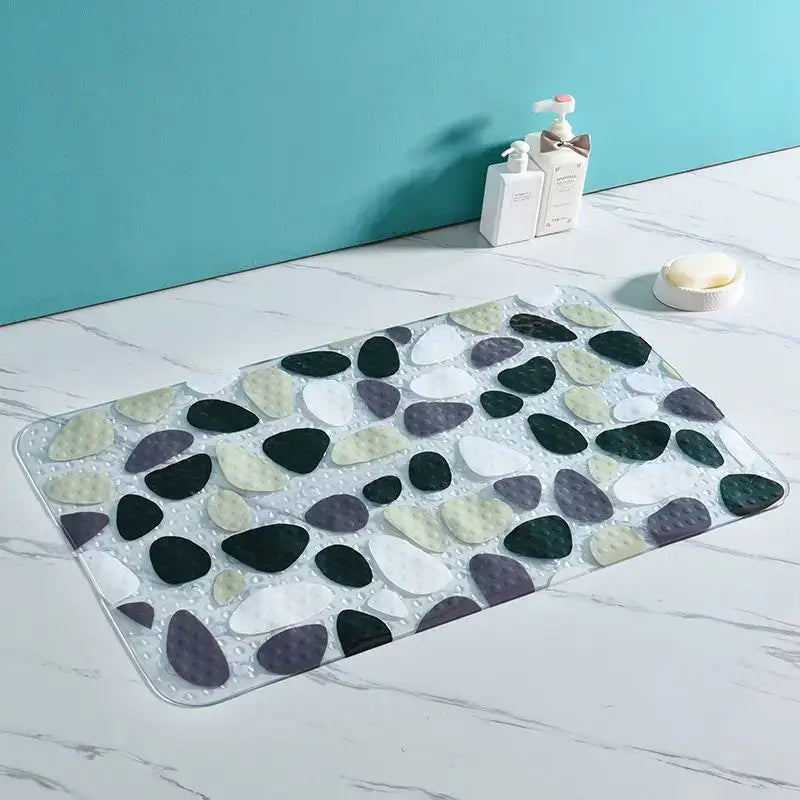 Transparent decorbites cartoon non-slip bathroom mat with embedded black white gray and pale green pebbles for children