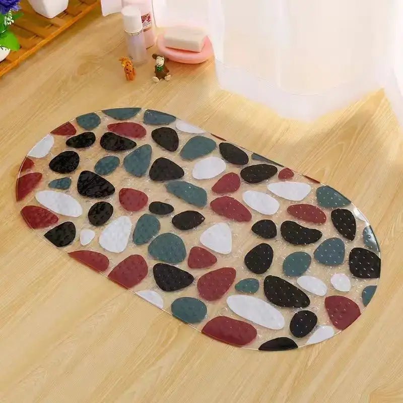 Oval-shaped transparent decorbites cartoon non-slip bathroom mat with colorful black white red and teal pebbles for children