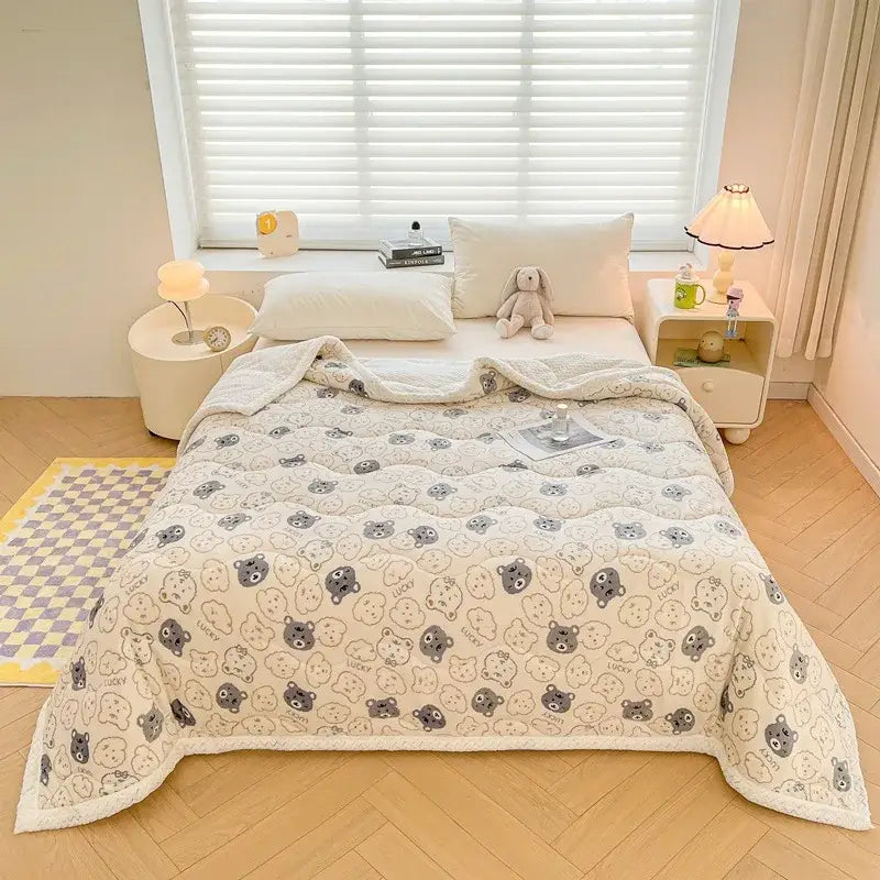 Cream-colored decorbites cartoon print cream velvet quilted blanket with plush texture and gray beige bear faces pattern