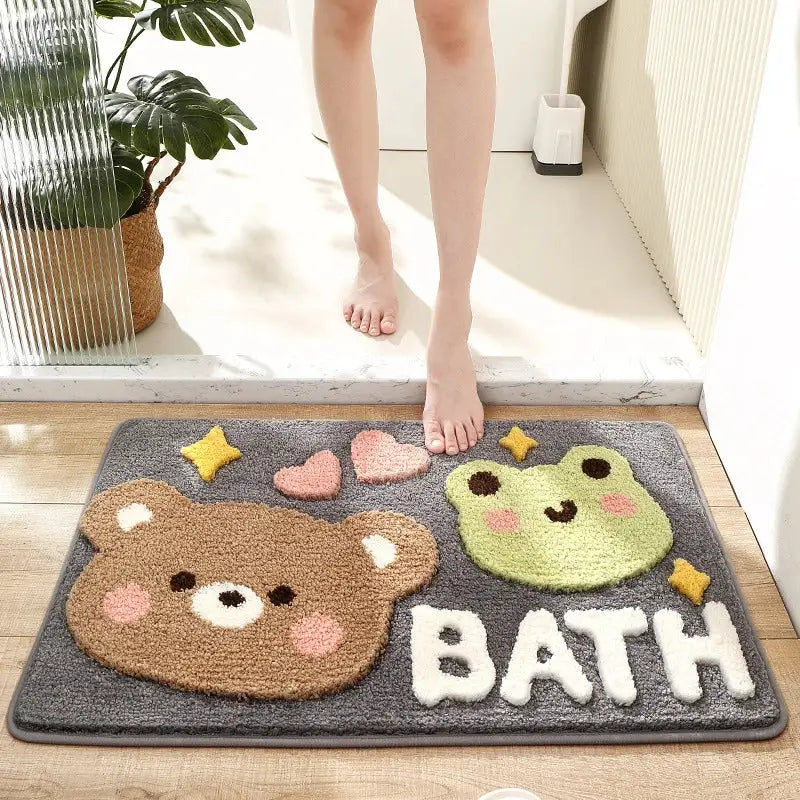 Gray decorbites cartoon puppy flocked bath mat with embroidered brown bear and green frog faces, hearts, stars, and bath lettering