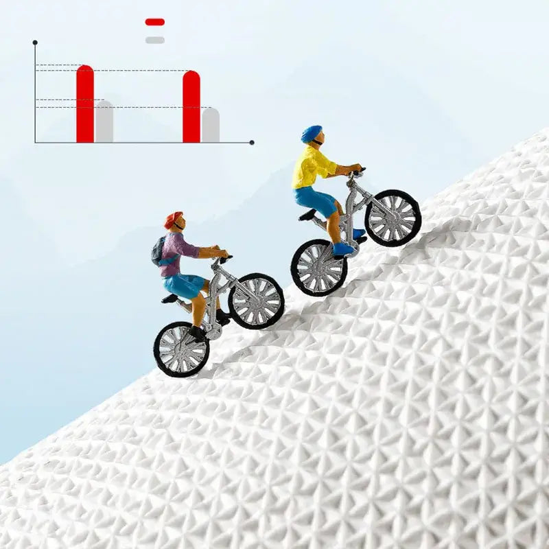 Two miniature mountain bikers ride silver bikes up a slope on a brown decorbites cartoon puppy flocked bath rug