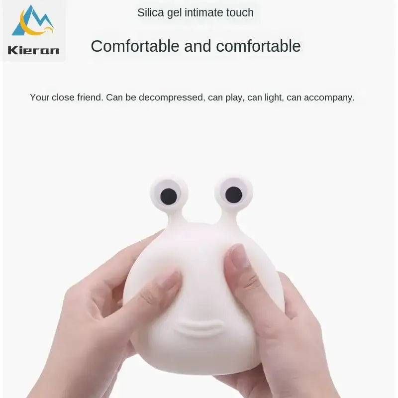 White silicone decorbites cartoon slug night light shaped like a tactile comfort snail with black eyes and subtle smile