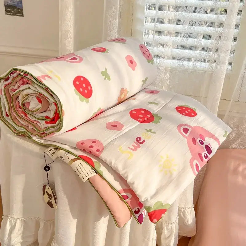 A soft white cotton decorbites cartoon summer blanket with pink strawberries and teddy bears for bedroom bedding