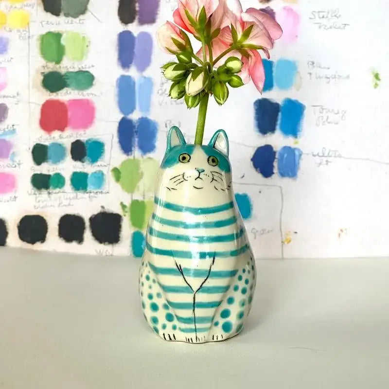 DecorBites™ cat vase in ceramic with turquoise and white polka dots holding a pink flower ideal as dot cat décor