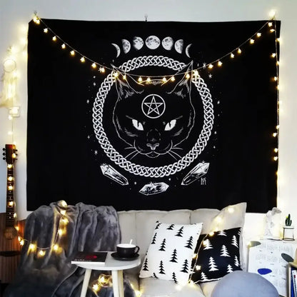 Black tapestry wall hanging by decorbites featuring cat witchcraft black face, pentagram, celtic knot, and moon phases
