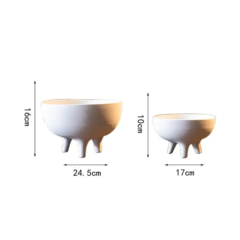 White ceramic flower pot with tripod stand featuring smooth matte finish and curved sides by DecorBites™