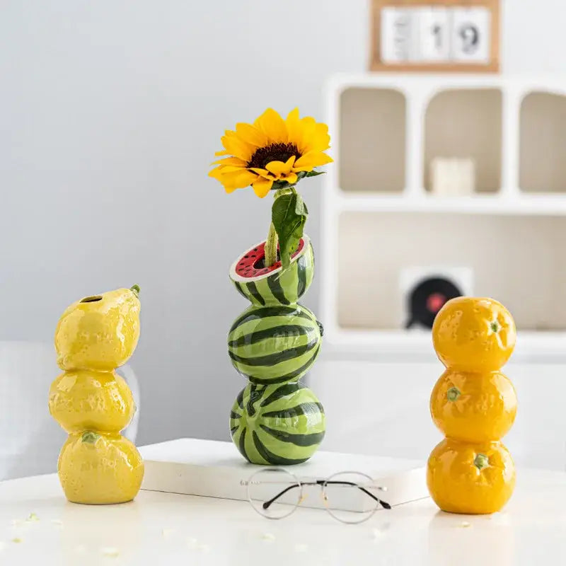 DecorBites™ ceramic fruit vase shaped like a green and black striped watermelon with a sunflower for home and office