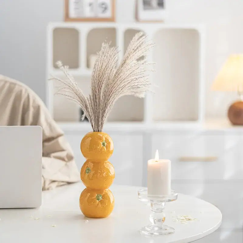DecorBites™ vibrant yellow ceramic fruit vase shaped like stacked oranges with green leaf accents for home and office