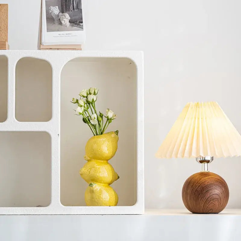 DecorBites™ vibrant yellow ceramic fruit vase shaped like stacked lemons holding delicate white flowers for home and office