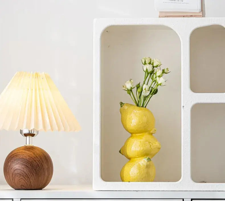Decorbites™ vibrant yellow ceramic fruit vase shaped like stacked lemons holding delicate white flowers for home and office