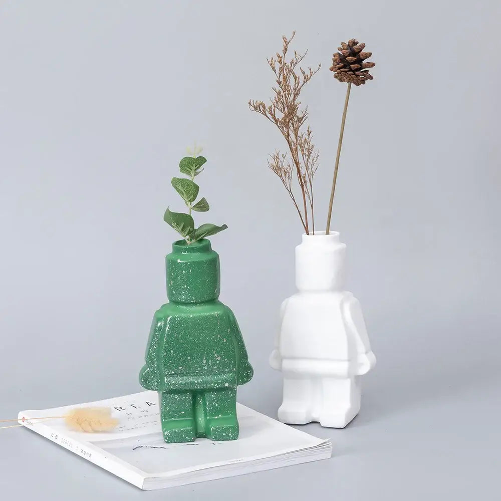 Green glittery ceramic robot vase shaped like lego minifigure with small plant nordic style home decor