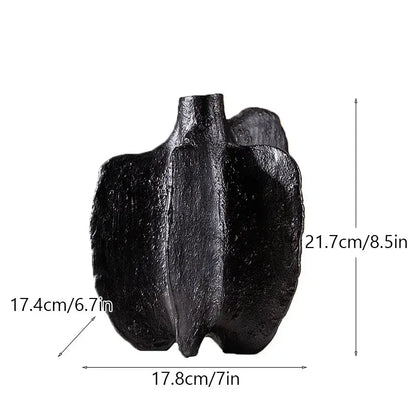 Black textured ceramic sea vase with sculpted asymmetrical form for nordic modern decor by decorbites