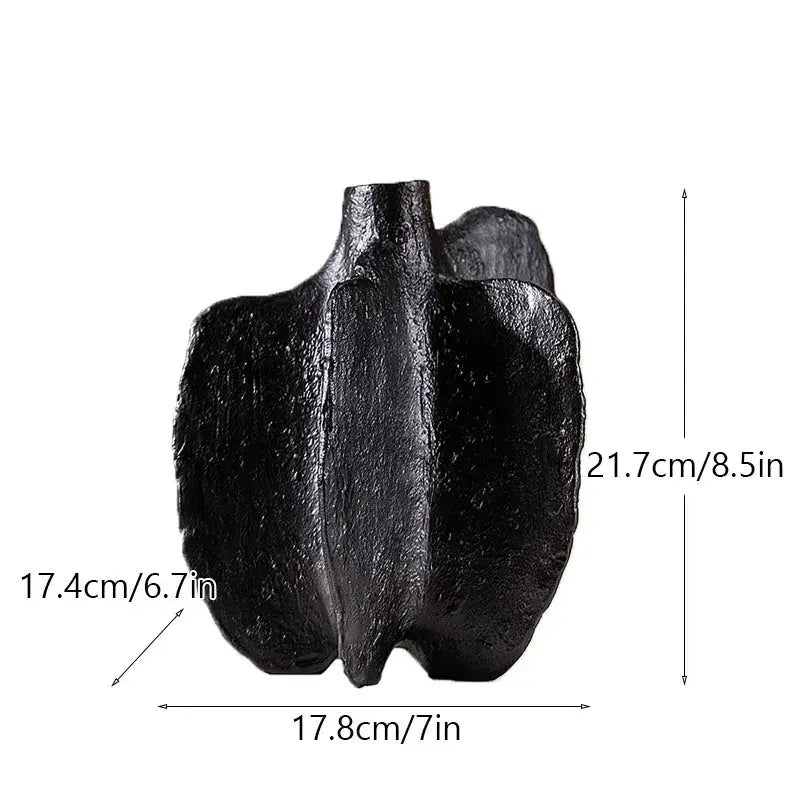 Black textured ceramic sea vase with sculpted asymmetrical form for nordic modern decor by decorbites