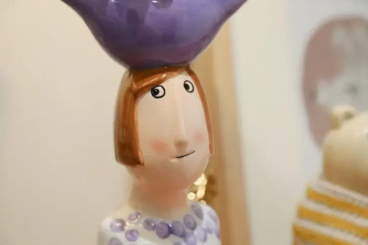 Decorbites™ ceramic vase set featuring a woman figurine with short brown hair and purple polka dot dress for home decor